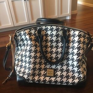 Dooney and Bourke 13L x 9H x 6D .